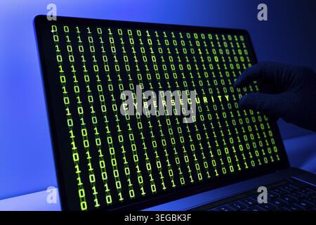 Ciber security concept. Gloved Hand, Binary code and cybersecurity word on laptop computer screen Stock Photo