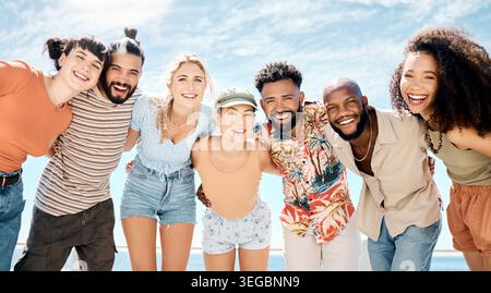 Reunion, embrace or friends at beach with portrait, good time or connection on summer holiday. Sunshine, diversity or happy people with hugging, group Stock Photo