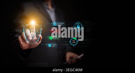 Businessman touching glowing AI cybersecurity shield with threat detected alert, compliance checked, access protected, privacy safe, low risk indicato Stock Photo
