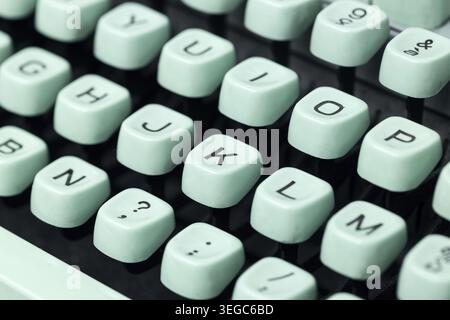 Close up of a vintage green typewriter keys. Selective focus Stock Photo