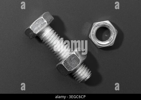 Metric Bolt and nut isolated on black background Stock Photo
