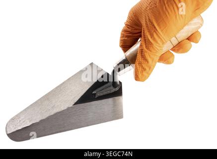 Hand Holding a Trowel isolated on White Background. Construction industry. Copy space Stock Photo