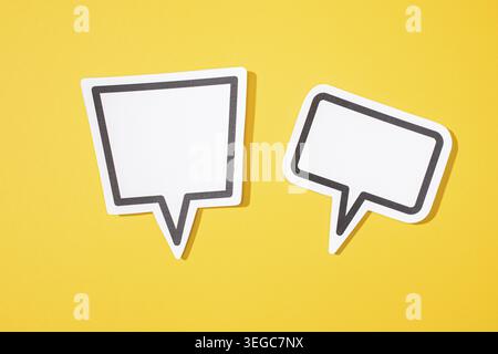 Two Blank Speech Bubble isolated on yellow background. Mock up template Stock Photo