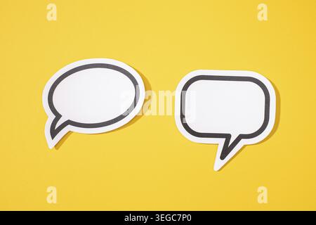 Two Blank Speech Bubble isolated on yellow background. Mock up template Stock Photo