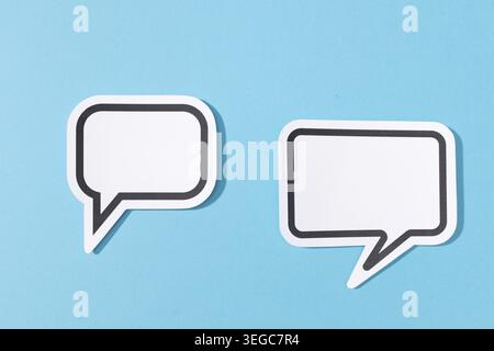 Two Blank Speech Bubble isolated on blue background. Mock up template Stock Photo