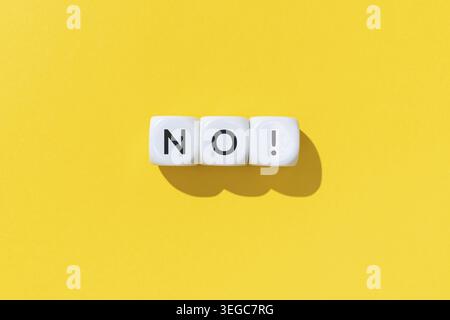 No word on white cube blocks isolated on yellow background Stock Photo