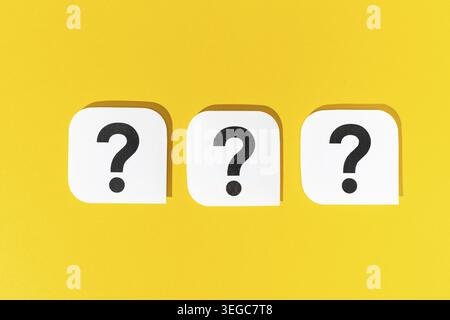 Group of Question marks signs on yellow background Stock Photo