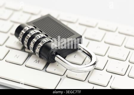 Closed padlock on computer keyboard. Cyber security concept Stock Photo