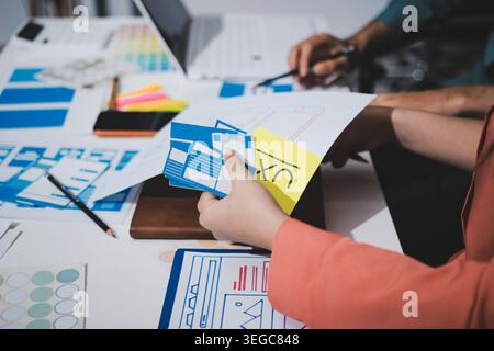 UI designer and UX developer brainstorm idea to design the application appearance in the early stage. Creative digital development agency. UX UI conce Stock Photo