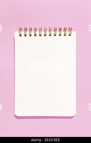 Blank white paper notebook Isolated on pink background. Template mock up Stock Photo