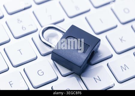 Computer Security and data privacy concept. Closed padlock on computer keyboard Stock Photo