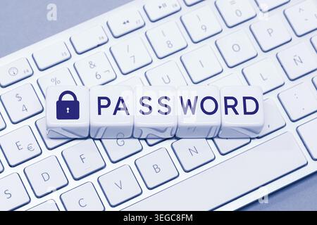 Password word and Closed padlock icon on cube blocks on computer keyboard. Computer data protection concept Stock Photo