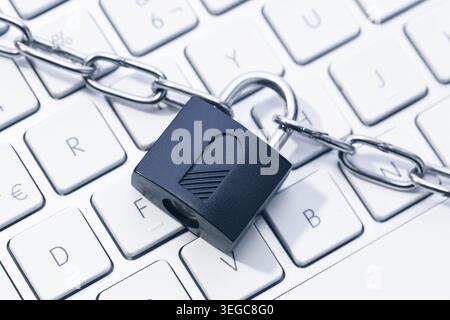 Computer Security and data privacy concept. Chain and padlock on keyboard Stock Photo