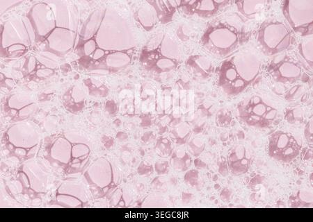 Skin care soap bubbles on pink background background texture. Full frame Stock Photo