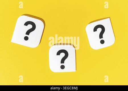 Group of Question marks signs on yellow background Stock Photo