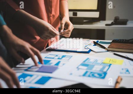 UI designer and UX developer brainstorm idea to design the application appearance in the early stage. Creative digital development agency. UX UI conce Stock Photo
