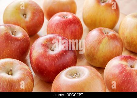 Closeup view of juicy apples on a wooden table Stock Photo