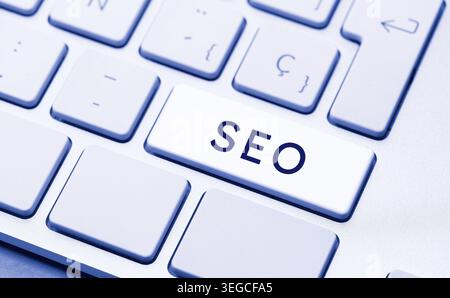 SEO Word on computer Keyboard Key. Search engine optimization concept Stock Photo