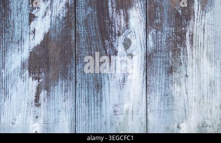 Abstract background texture of Aged wooden planks with white and blue peeling paint. Full frame Stock Photo