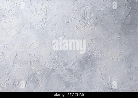 White decorative plaster texture with rough abstract wall pattern and minimal neutral background for branding and design. Stock Photo