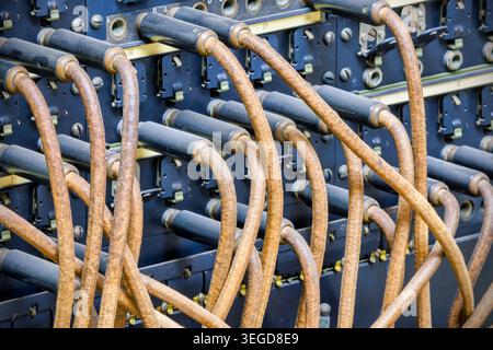 Vintage telecommunications telephone switchboard with connected wires Stock Photo