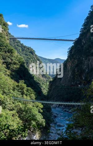 View of the suspension bridge at Taroko National Park with metal ...