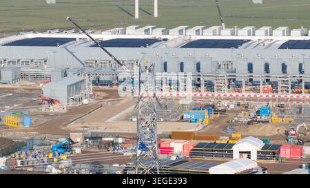 Groningen, Netherlands - 20 January 2026: Aerial view of Datacenter Westpoort under construction with cranes, shipping containers, and solar panels. Stock Photo