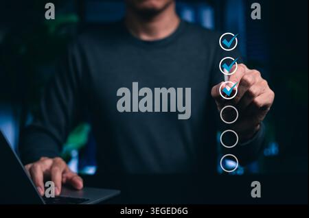 Digital checklist completion and task progress verification concept. Person selecting virtual check marks. online form approval, workflow tracking, Stock Photo