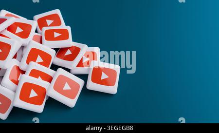 Logo of the video sharing platform YouTube in a big pile on blue background with copy space as web banner header Stock Photo