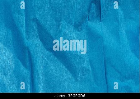 Blue matte wrinkled paper texture background macro close up view Stock Photo