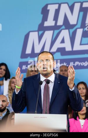 Mqabba, Malta - May 17th, 2026, Politician Giving Passionate Speech At Campaign Rally On Podium With Supportive Crowd Behind Stock Photo