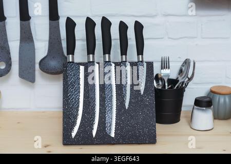 Highcontrast Backsplash Complements Organized Knife Set On Kitchen Counter For Convenience Stock Photo