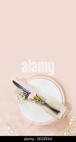 Rustic Wedding Table Setting With Knife And Fork Wrapped In Linen On Plate Stock Photo