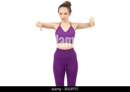 Young athletic woman stretching arms isolated on white background Stock Photo