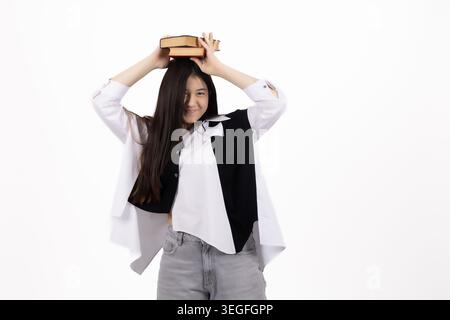 Young expressive woman holding hands on head looking surprised Stock Photo