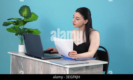 Disappointed business woman throwing folder on table in office room Stock Photo
