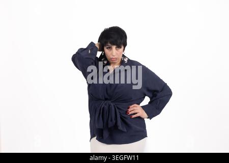 Stressed mature business woman holding head suffering from headache Stock Photo