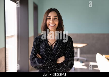 Headshot of smiling businesswoman looking at camera Stock Photo