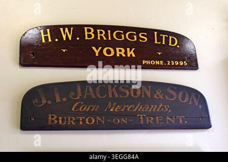 Historic grain merchant name boards for H. W. Briggs Ltd of York and H. Jackson & Son of Burton-on-Trent inside Leeds Corn Exchange, Leeds, England, U Stock Photo