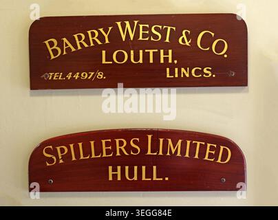 Historic grain merchant name boards for Barry West & Co of Louth and Spillers Limited of Hull inside Leeds Corn Exchange, Leeds, England, UK. Stock Photo