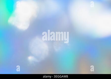 Holographic glowing blue and white bokeh light reflections Stock Photo