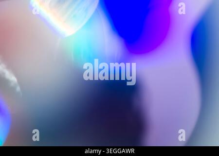 Abstract dark background with distorted neon blue and violet light flares Stock Photo