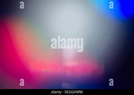 Intense red and magenta light bleed overlay with deep blue vignette Stock Photo