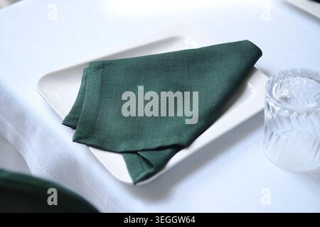 Table setting with a folded napkin on a plate Stock Photo