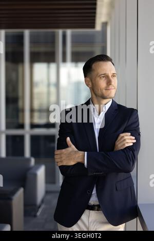 Confident businessman or executive reflecting on strategic opportunities in office Stock Photo