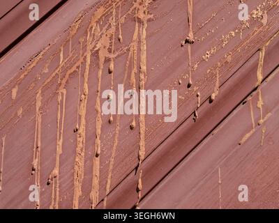 red painted wood planks with resin streaks, outdoors background texture Stock Photo