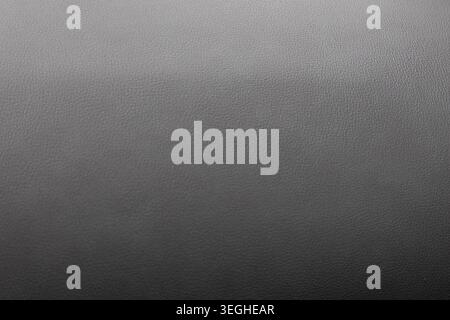 Grey gritty texture creating an abstract noise background surface Stock Photo