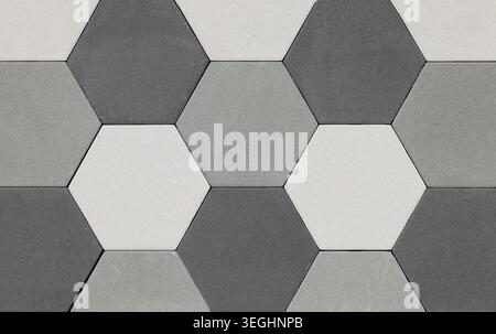 Hexagonal tiles for outdoors and pavements, top view. Colors are black, white and gray. Texture, full frame. Stock Photo