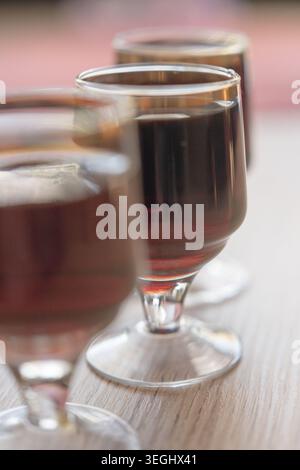 Herbal liqueur in a glass, drinking alcohol. Stock Photo