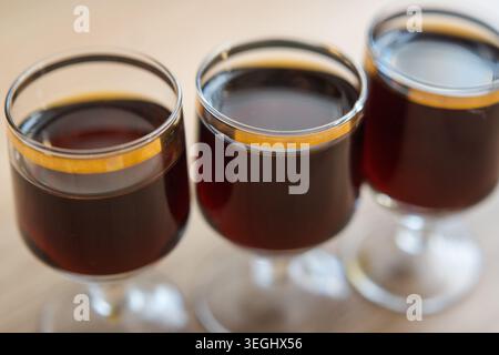 Herbal liqueur in a glass, drinking alcohol. Stock Photo